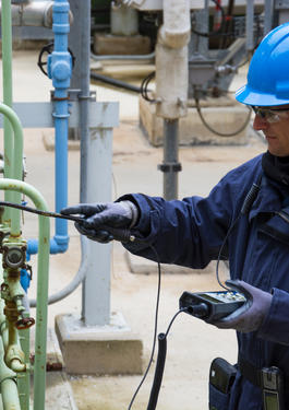 Worker inspecting equipment