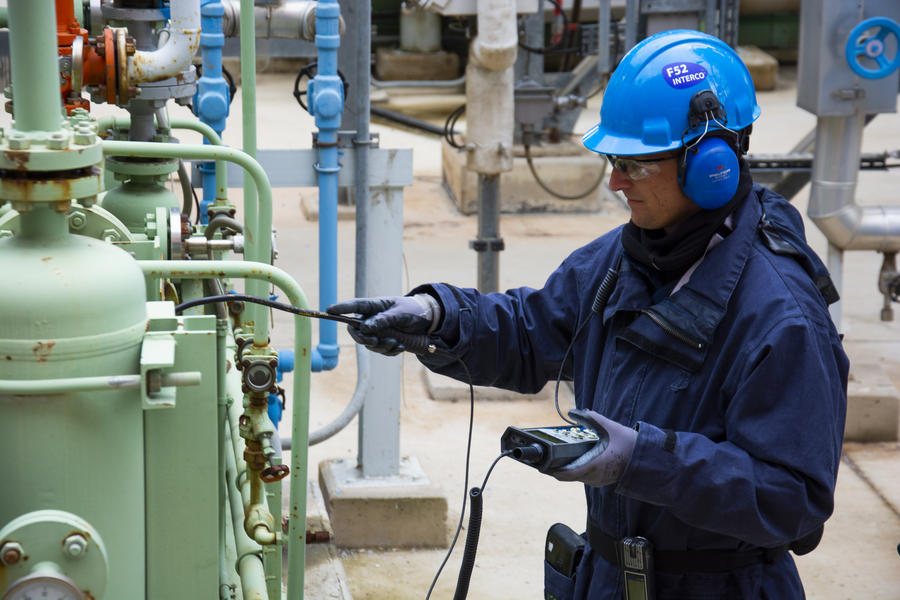 Worker inspecting equipment